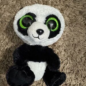 Adorable Black and White Panda Plush with Green Eyes